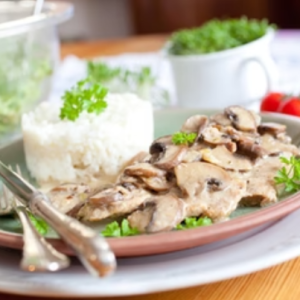 Sliced ​​chicken with mushrooms, vegetables, spicy rice